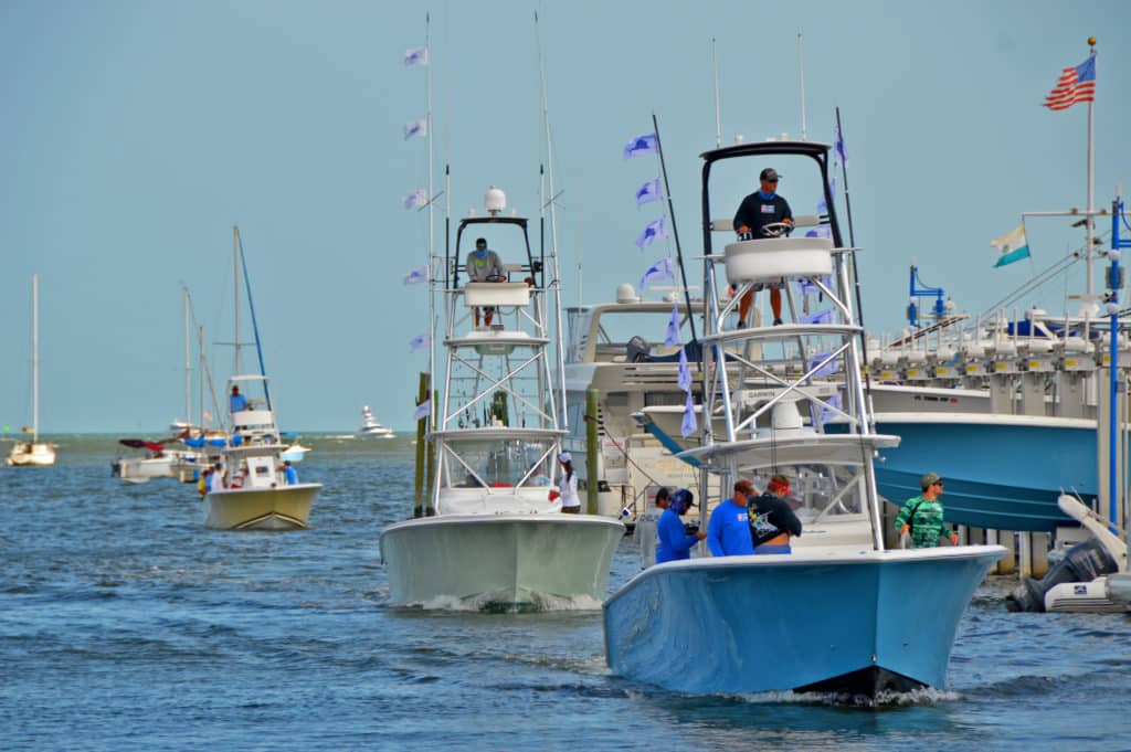 sailfish flags flying on center consoles south florida