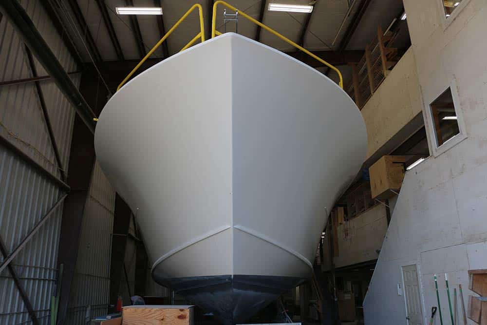 front view of a yacht hull under construction