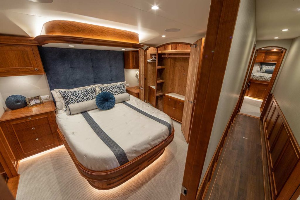 Interior stateroom of the Jarrett Bay Boatworks sport fishing boat with woodwork.