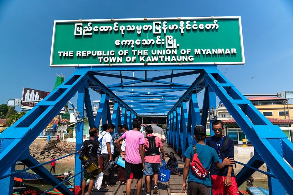 bridge and sign over the entrance to myanmar