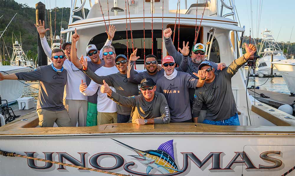 team uno mas celebrating on their boat deck