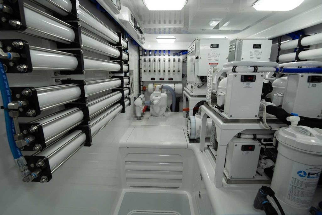 The stark white engine room of a Bayliss Boatworks sport fishing boat.