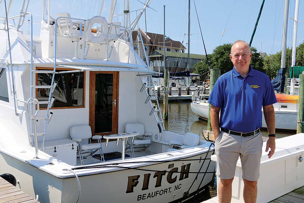 dan webb next to hatteras yacht