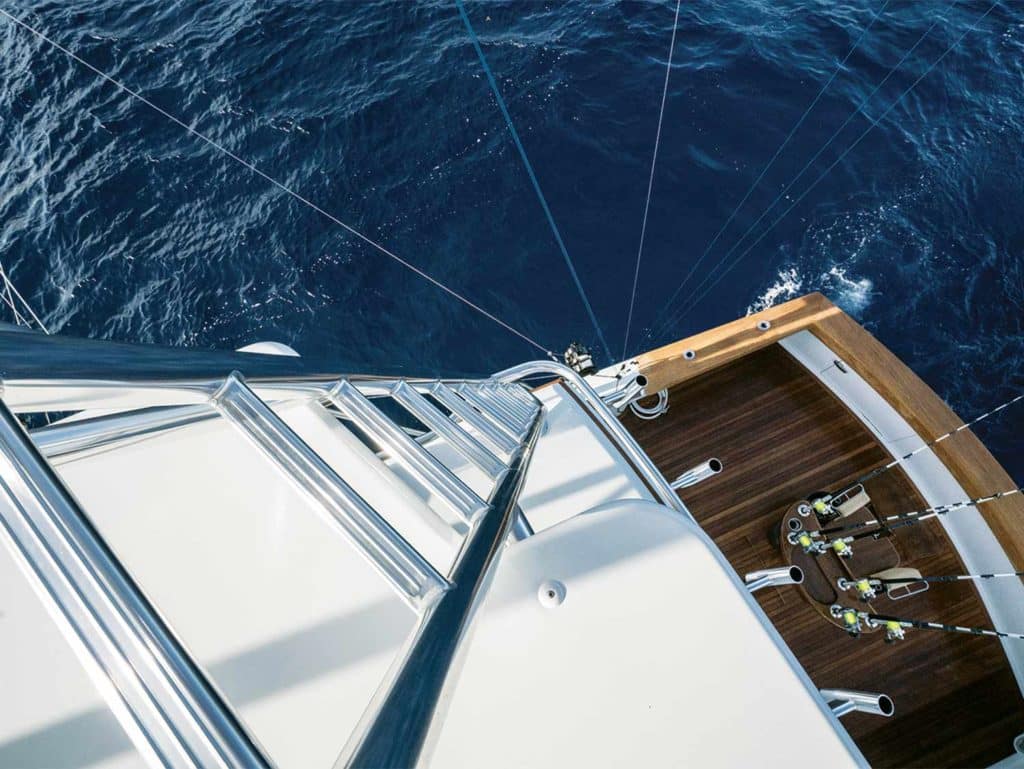 A ladder attached to a tall tower on an American Custom Yachts sport fishing boat.