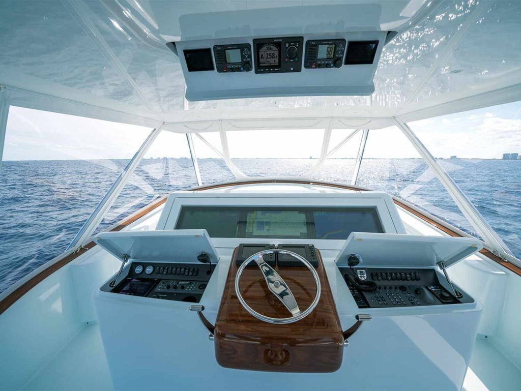 The helm and console of an American Custom Yacht sport fishing boat.