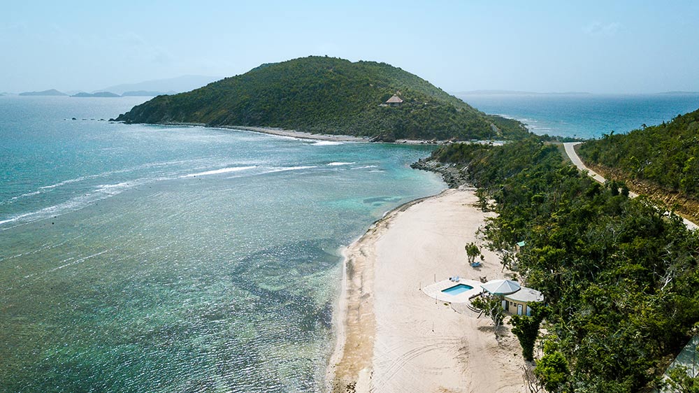 aerial view of scrub island's north beach