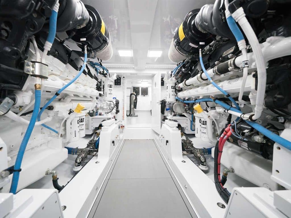 The clean and spacious engine room of an American Custom Yacht sport fishing boat.
