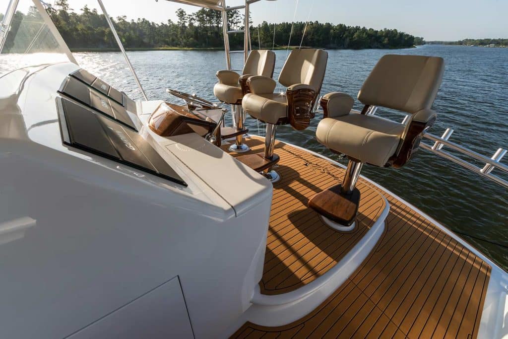 Three chairs at the helm of a Jarrett Bay Boatworks custom sport fishing yacht.