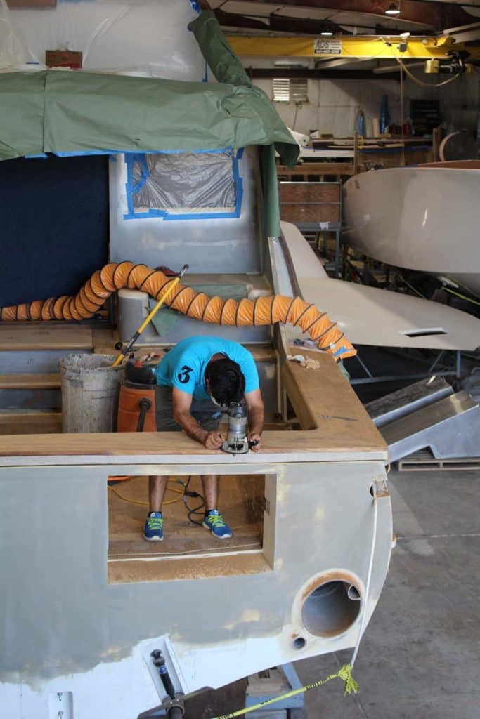 worker making final adjustments to cover boards