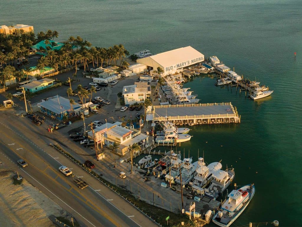 An aerial photo of Bud & Mary's Marina showing a fleet of sport-fishing boats.