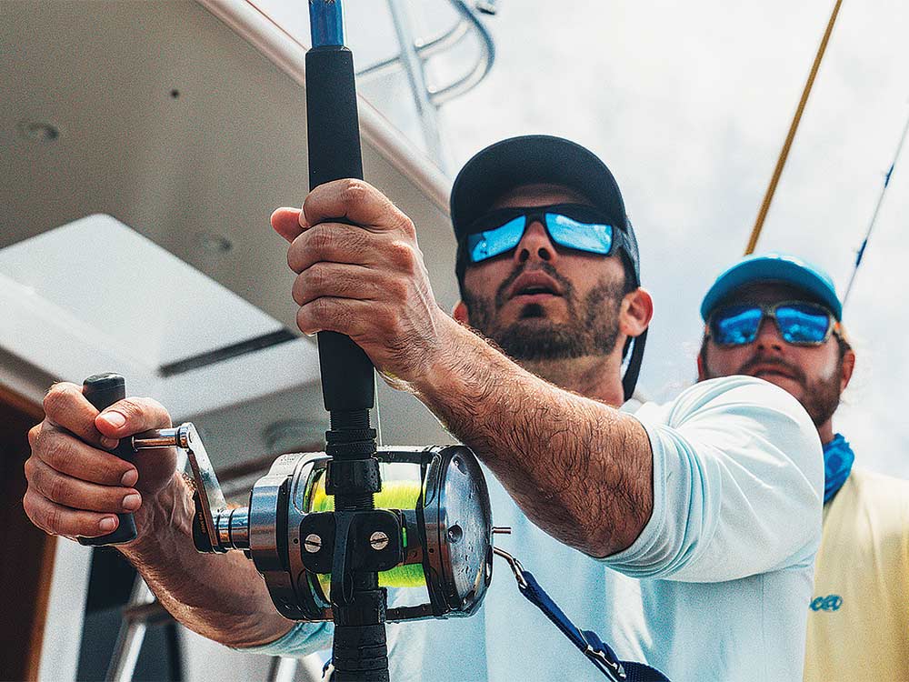 angler reeling in a giant marlin
