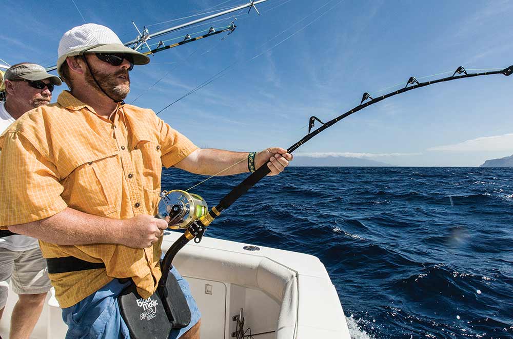 anglers fishing off a boat transom