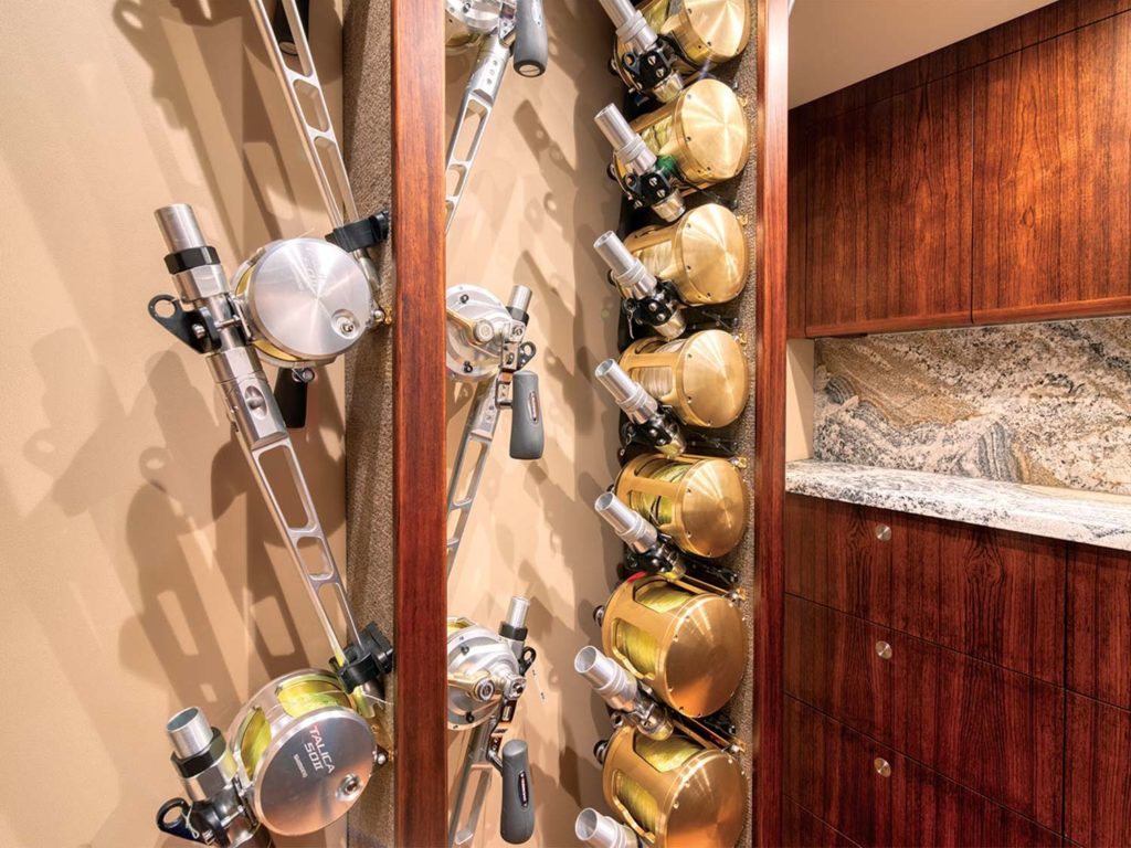 Several fishing reels and rods in storage.