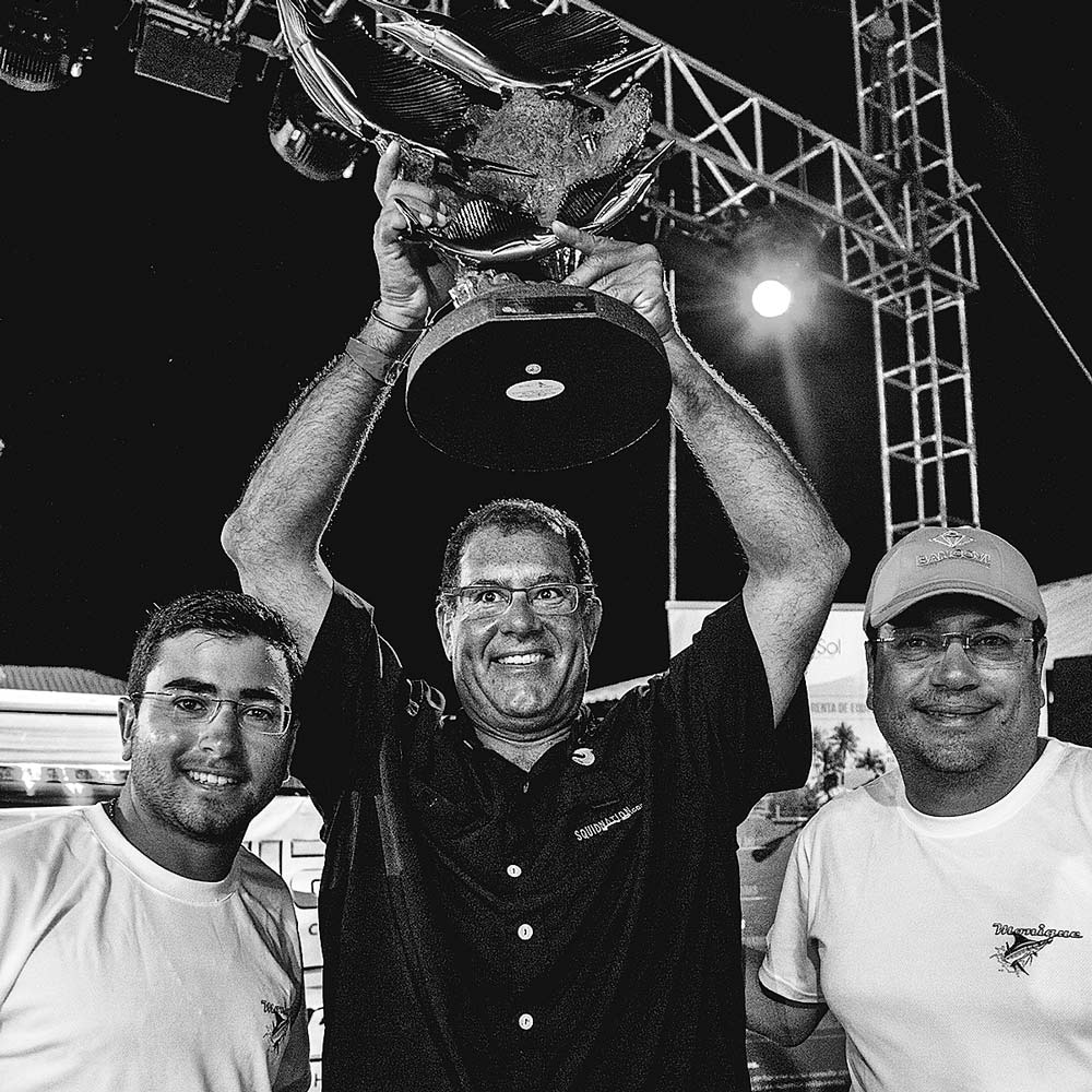 three men celebrating victory at El Salvador International Billfish Tournament