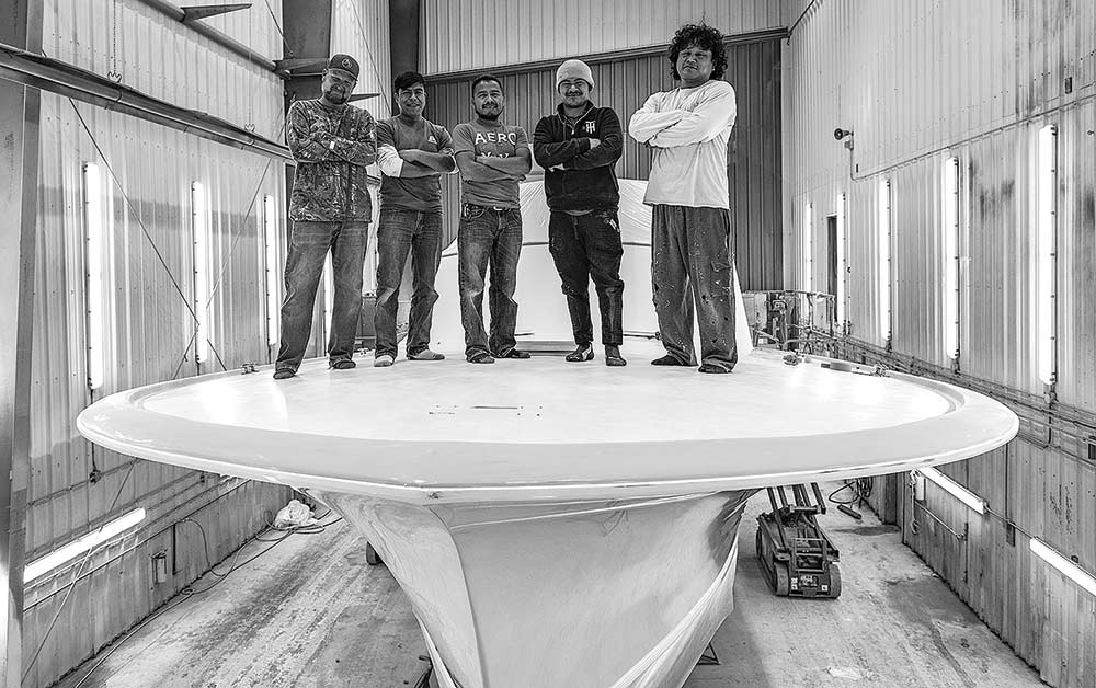 men standing on a boat hull