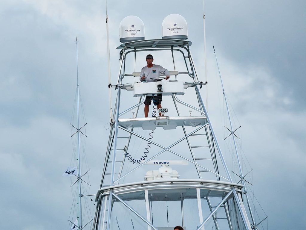 A boat captain in a communications tower.