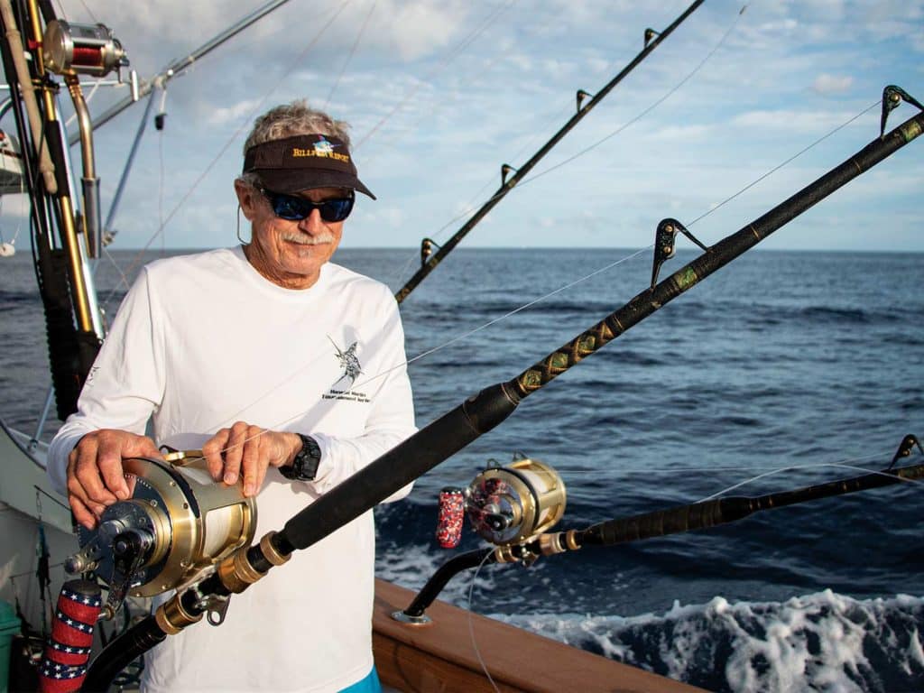 Capt. Chip Van Mols preparing fishing feels in the cockpit.