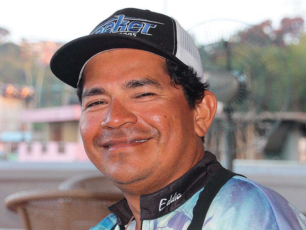 man smiling wearing hat