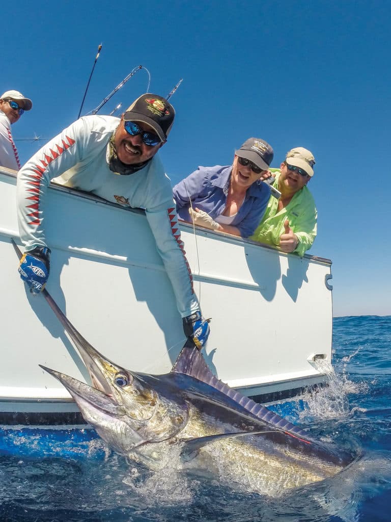 Nicolas Melendrez (left), a mate aboard Rum Line, surpassed 30,000 billfish releases.