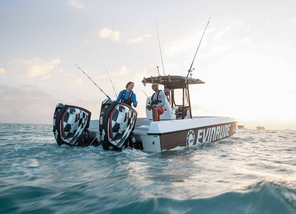 two men fishing on an outboard motor boat