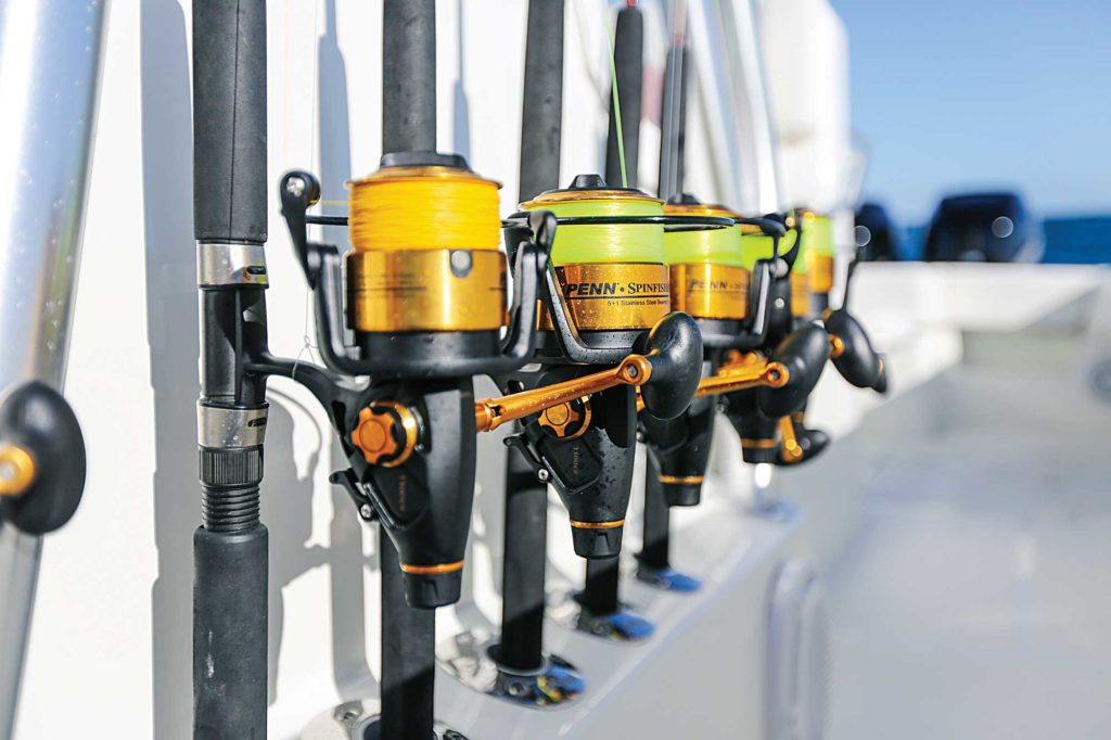 a row of fishing rods and reels