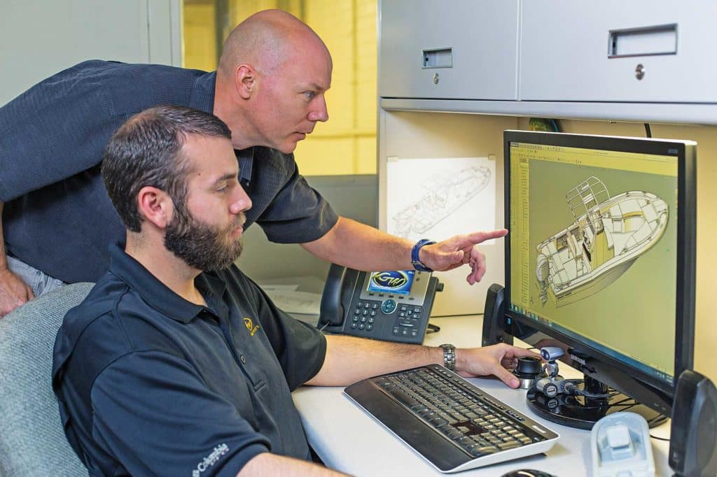 two cad engineers designing a boat