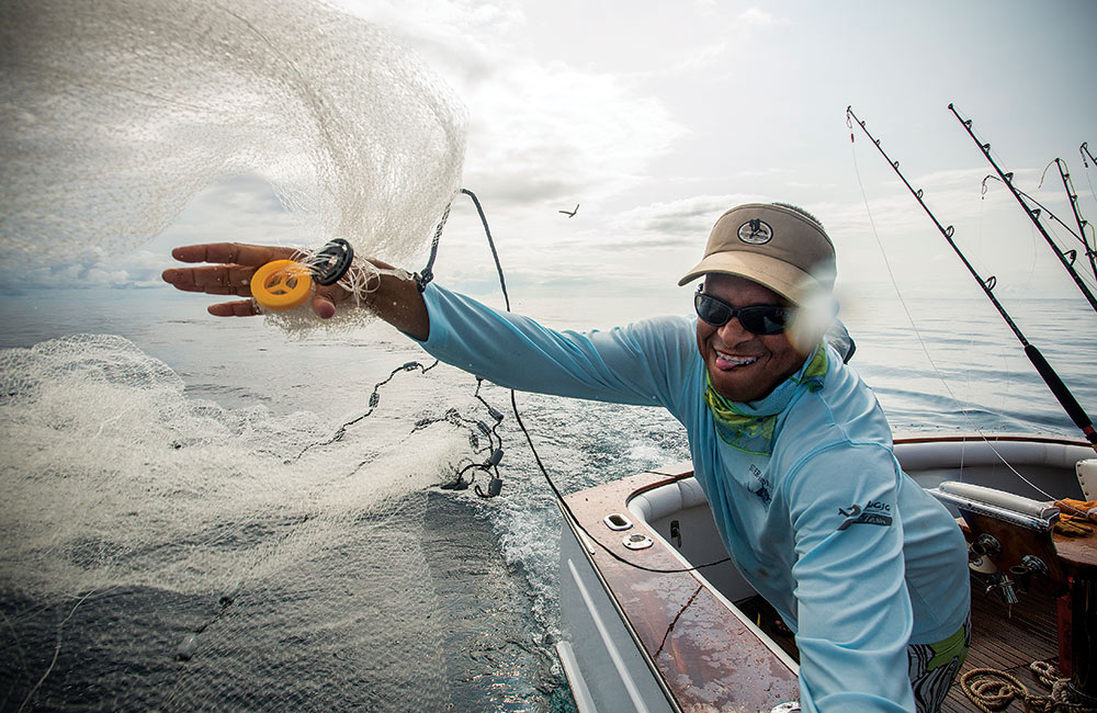 throwing a cast net for bait