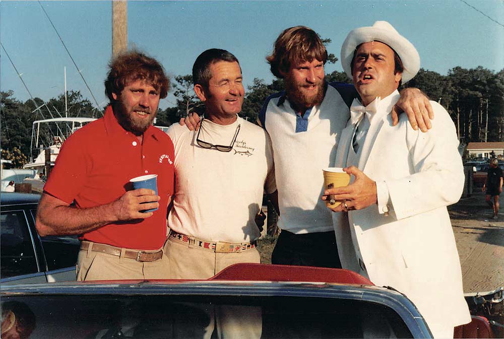 four men celebrating a boat christening