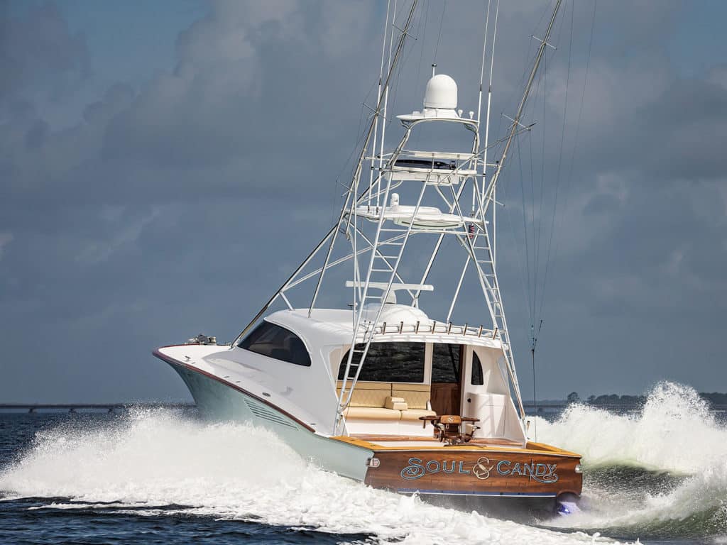 The F&S Boatworks 61 Hardtop Express sport fishing boat on the water making waves.