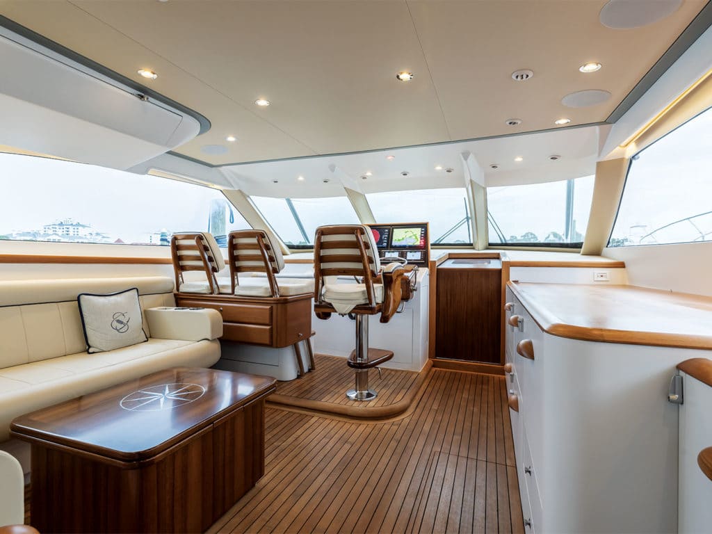 The interior salon and helm of the F&S Boatworks 61 Hardtop Express.