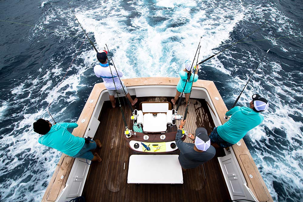 four anglers fishing and tracking billfish