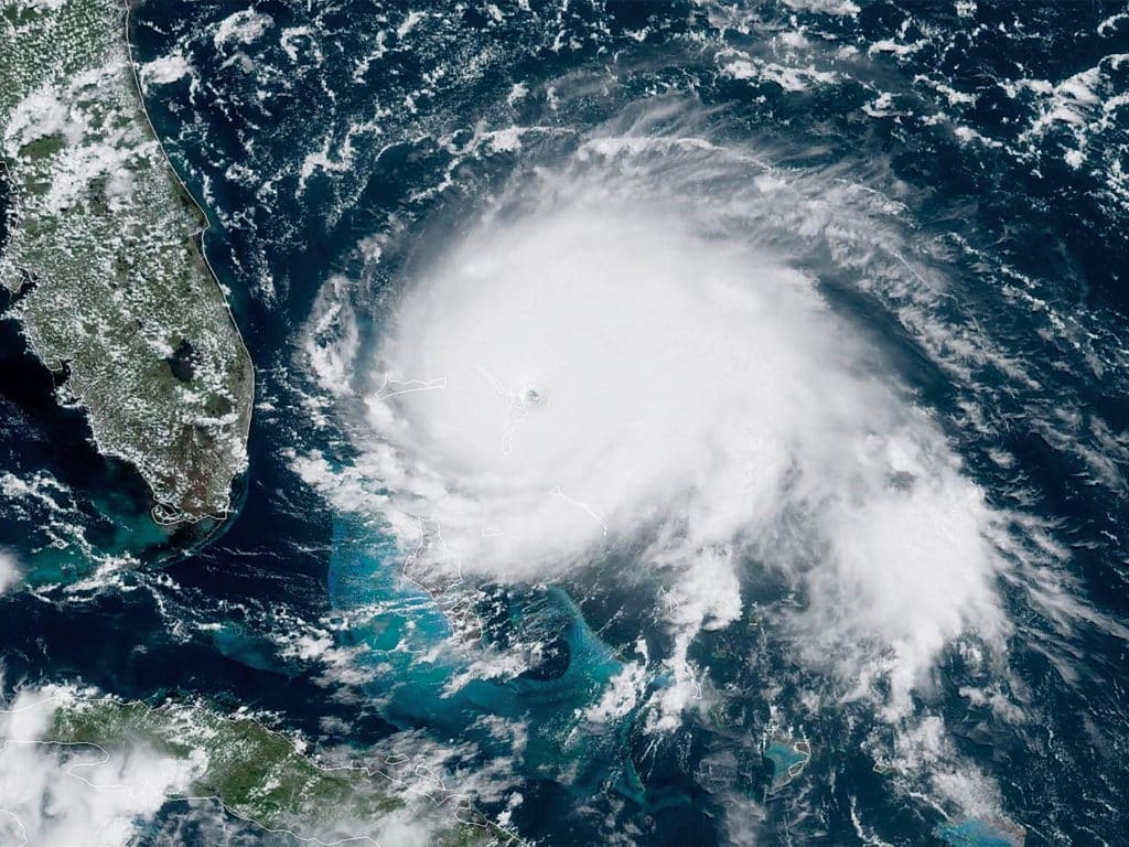 satellite imagery of a hurricane forming off the eastern coast of florida.