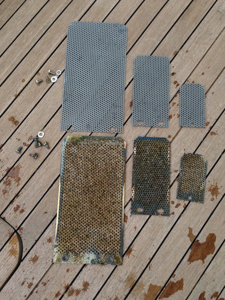 cleaning and replacing through hull screens on boat