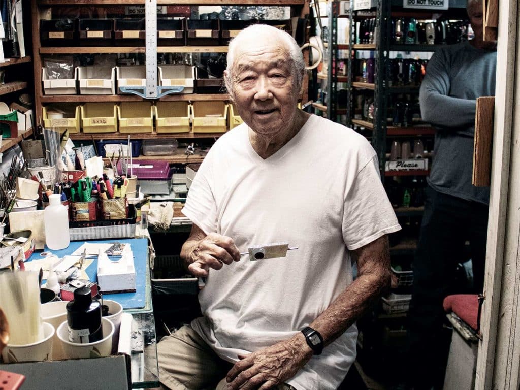 Joe Yee creating marlin lures in his workshop.