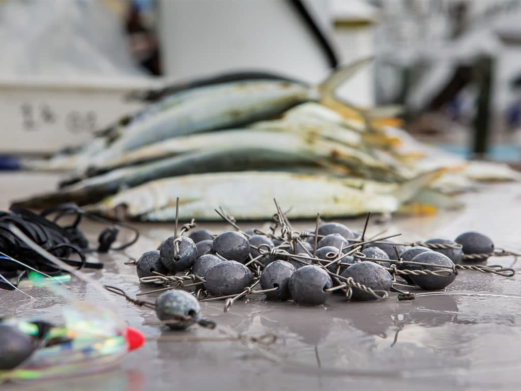 A pile of dredge bait weights on a prep table.