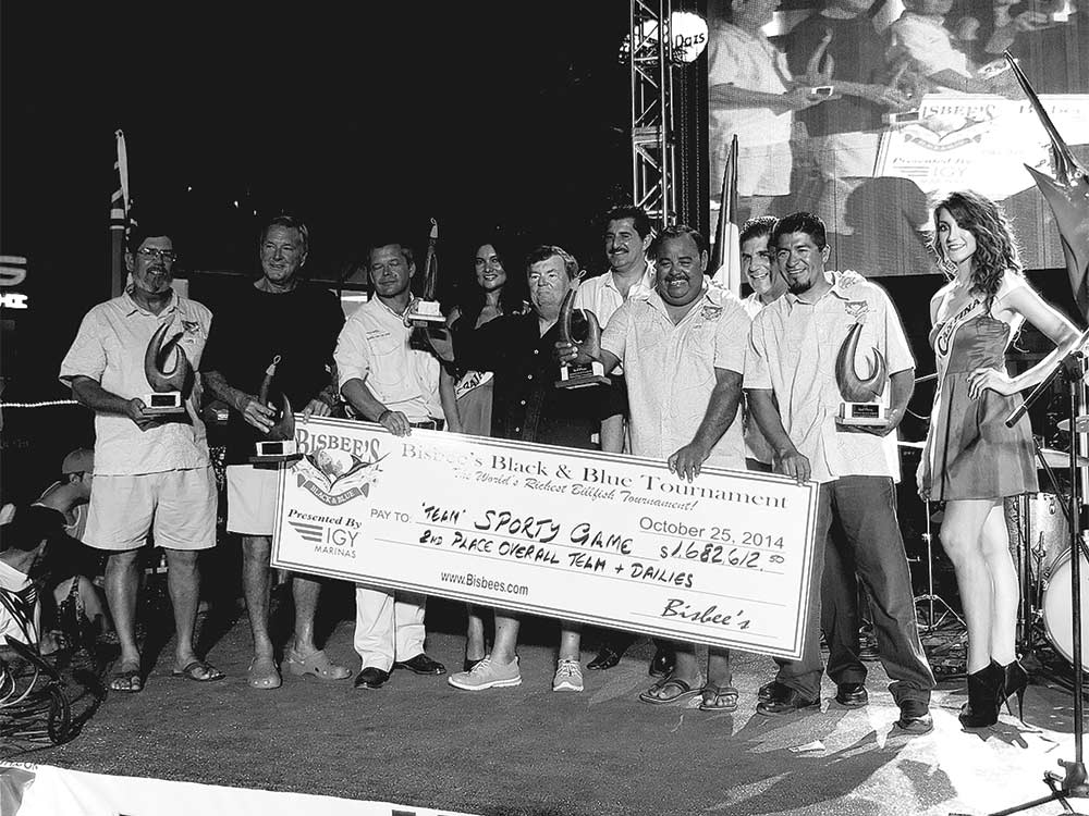 tournament winners standing with a seven-figure paycheck