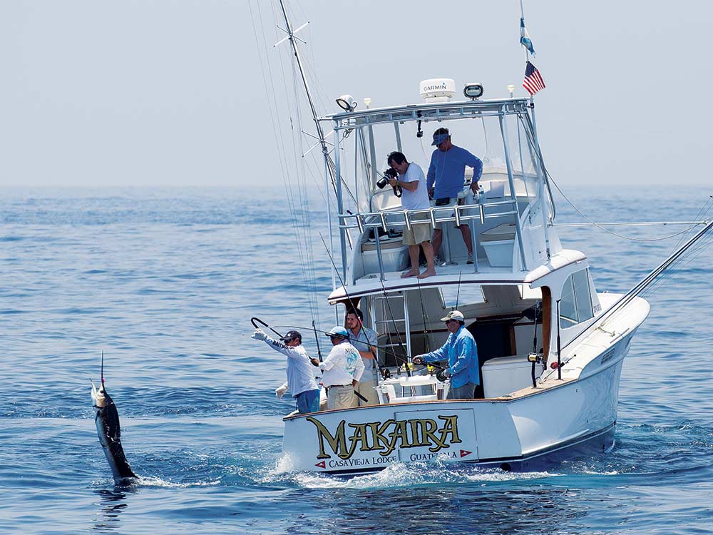 makaira fishing boat with fisherman catching a marlin