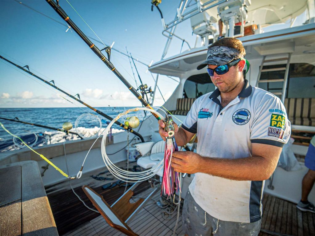 angler tying a deep sea fishing lure