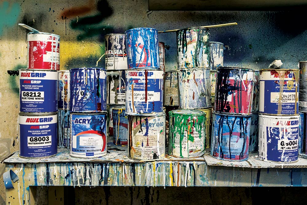 buckets of paint on a table