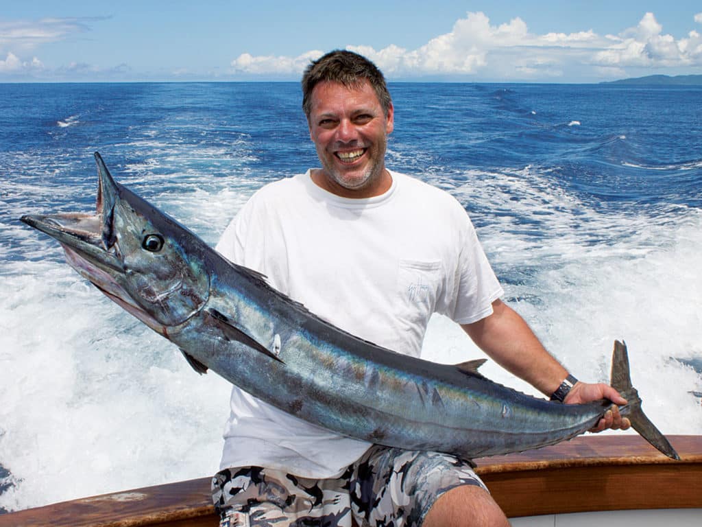 As quick as a flash, McNally was in the chair, fighting the 40-pound wahoo to a standstill. He was filled with excitement and wanted a photo with his wahoo the moment it hit the deck.