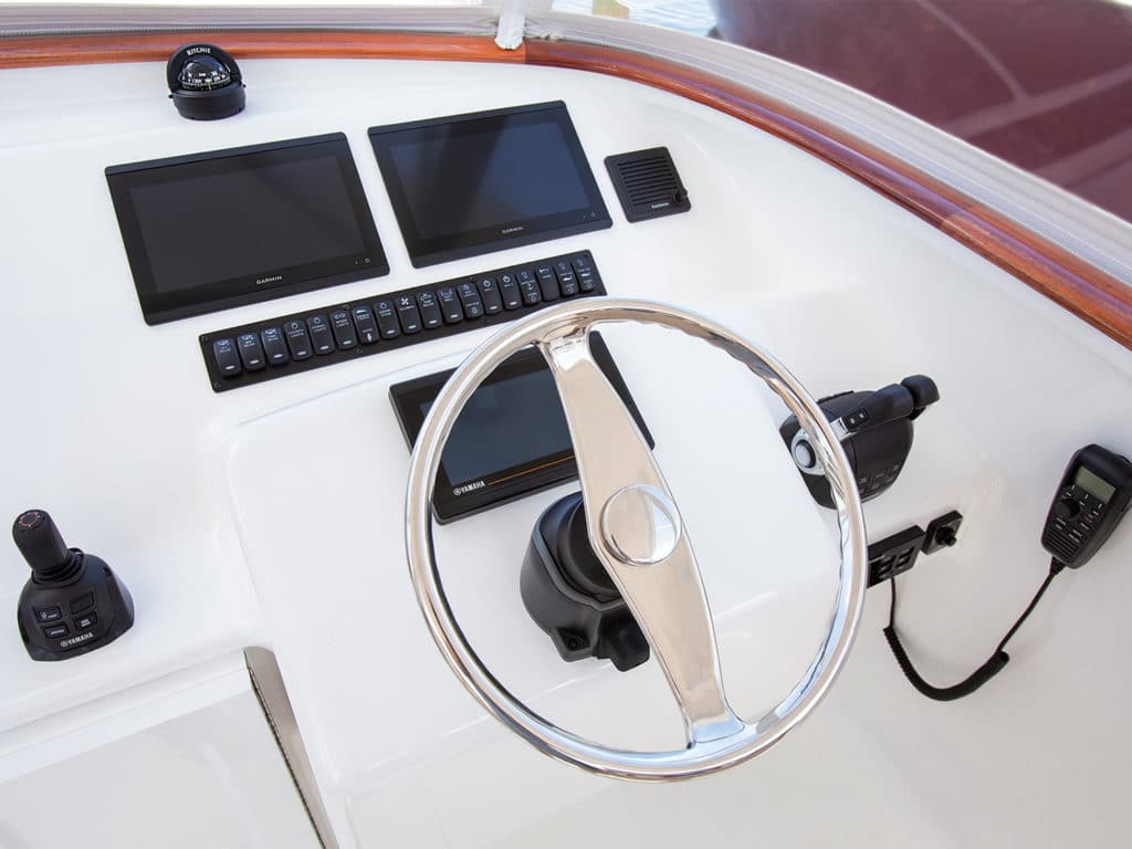 The helm and wheel of the Maverick 39 sport fishing boat.