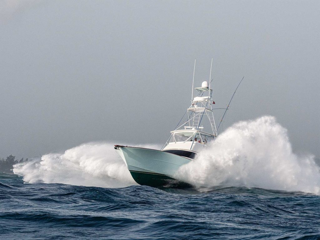 sport fishing yacht on the water making large waves