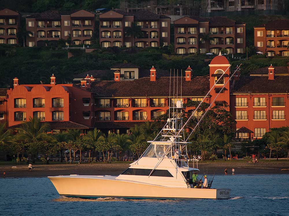 sport fishing boat at sunset