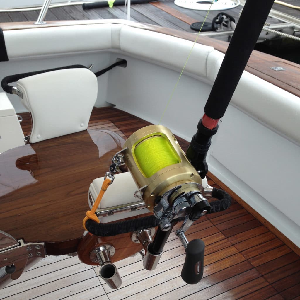 rod on fishing boat in chair rod holder