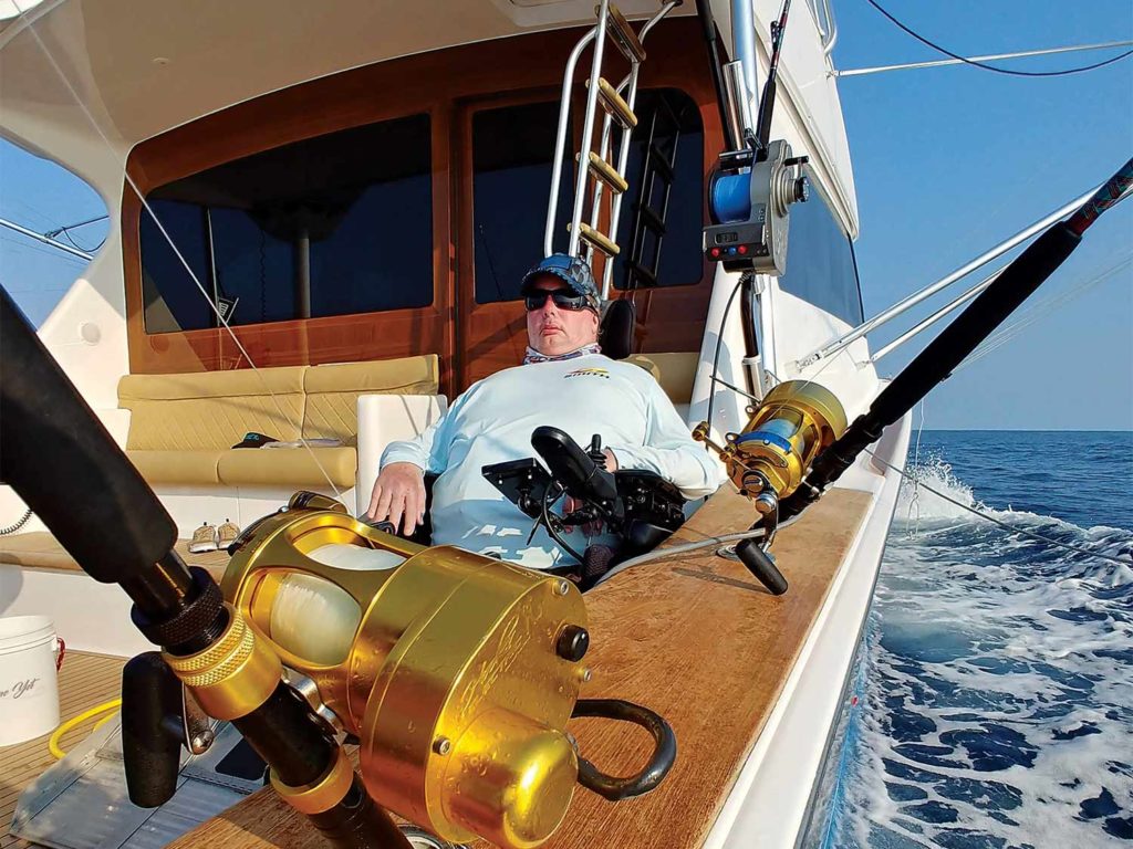 a man in a wheelchair on a boat deck