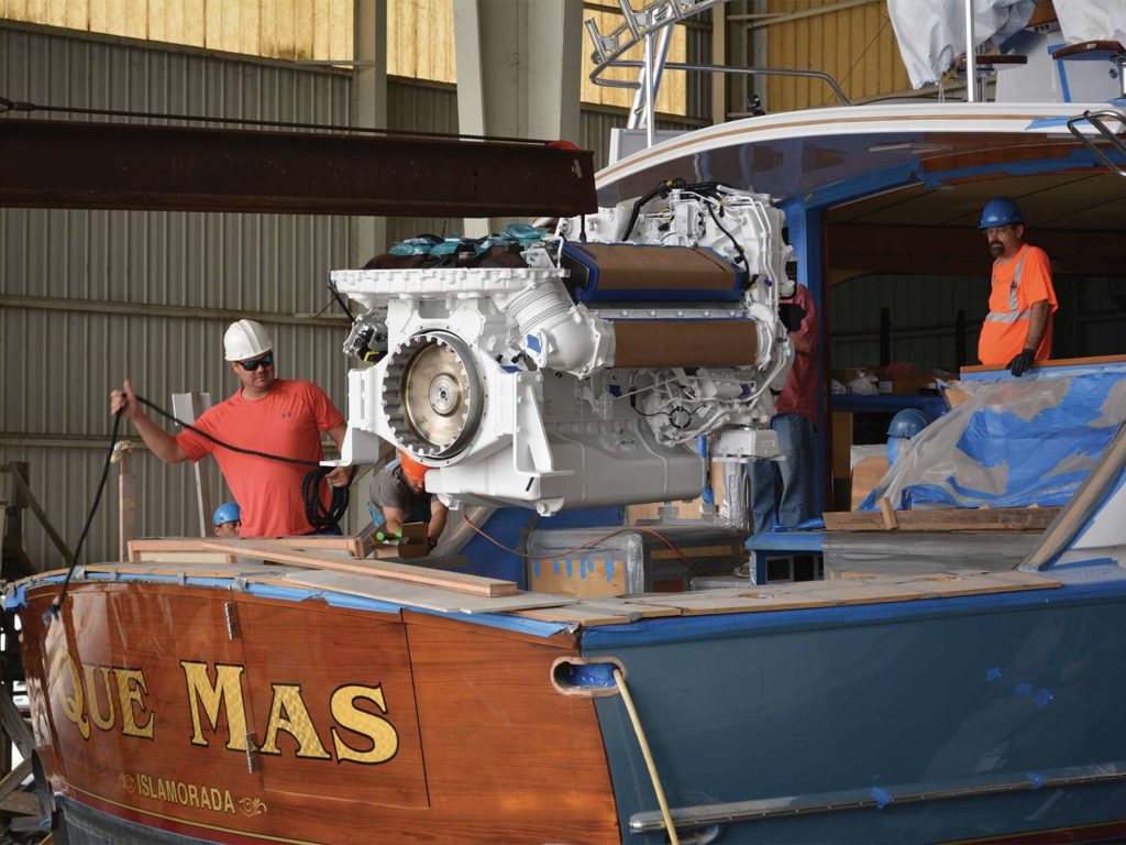 A sport-fishing boat sits in dry dock during boat upgrades.