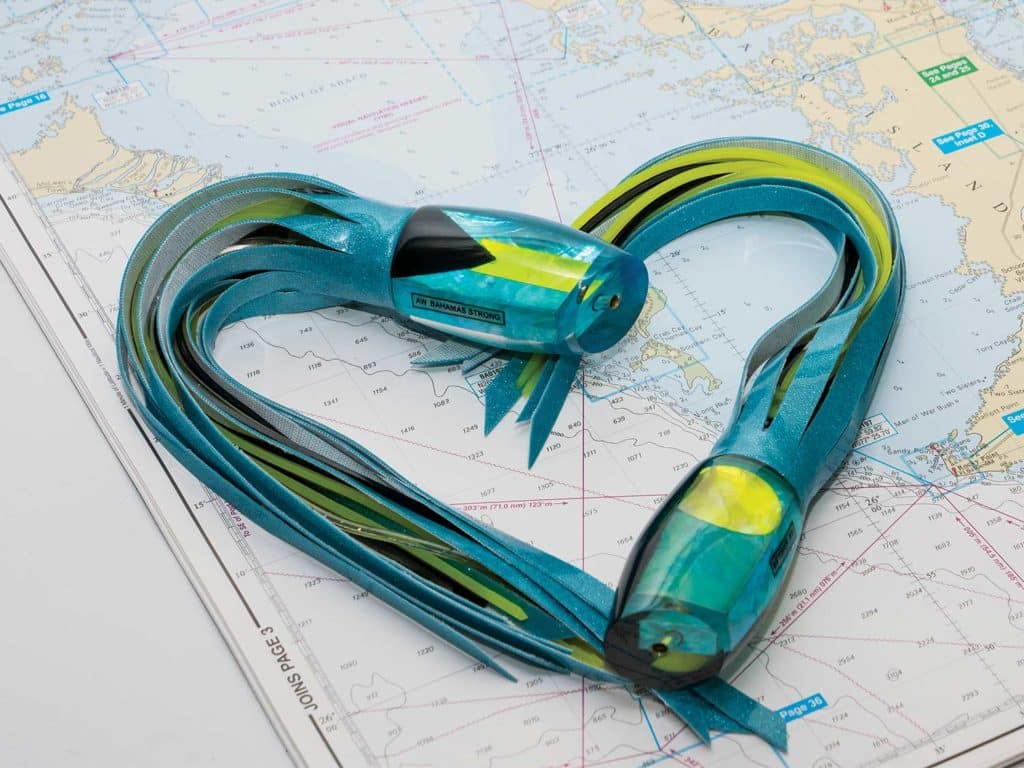 Two sport fishing lures in the shape of a heart on a map.