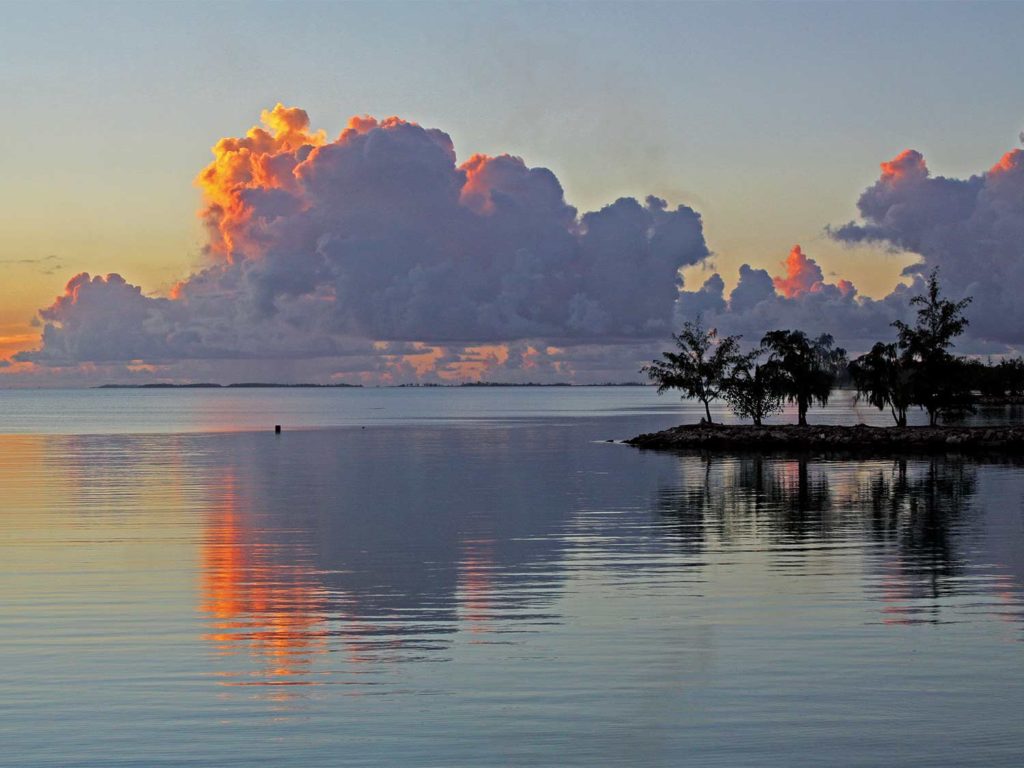 a sunset in tahiti over the ocean