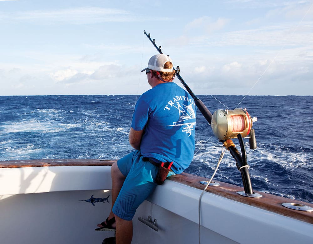 deckhand wearing pliers and release knife