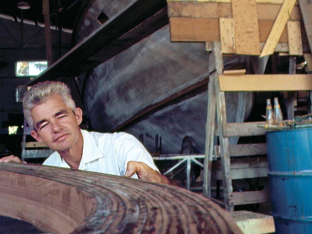 tommy rybovich inspecting wooden frame